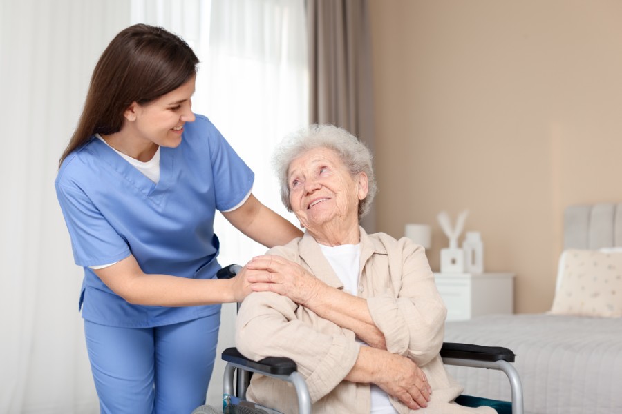 Registered nurse checking vital signs during a home visit